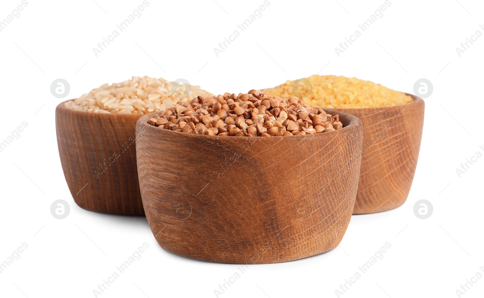 Photo of Different cereal grains in wooden bowls isolated on white