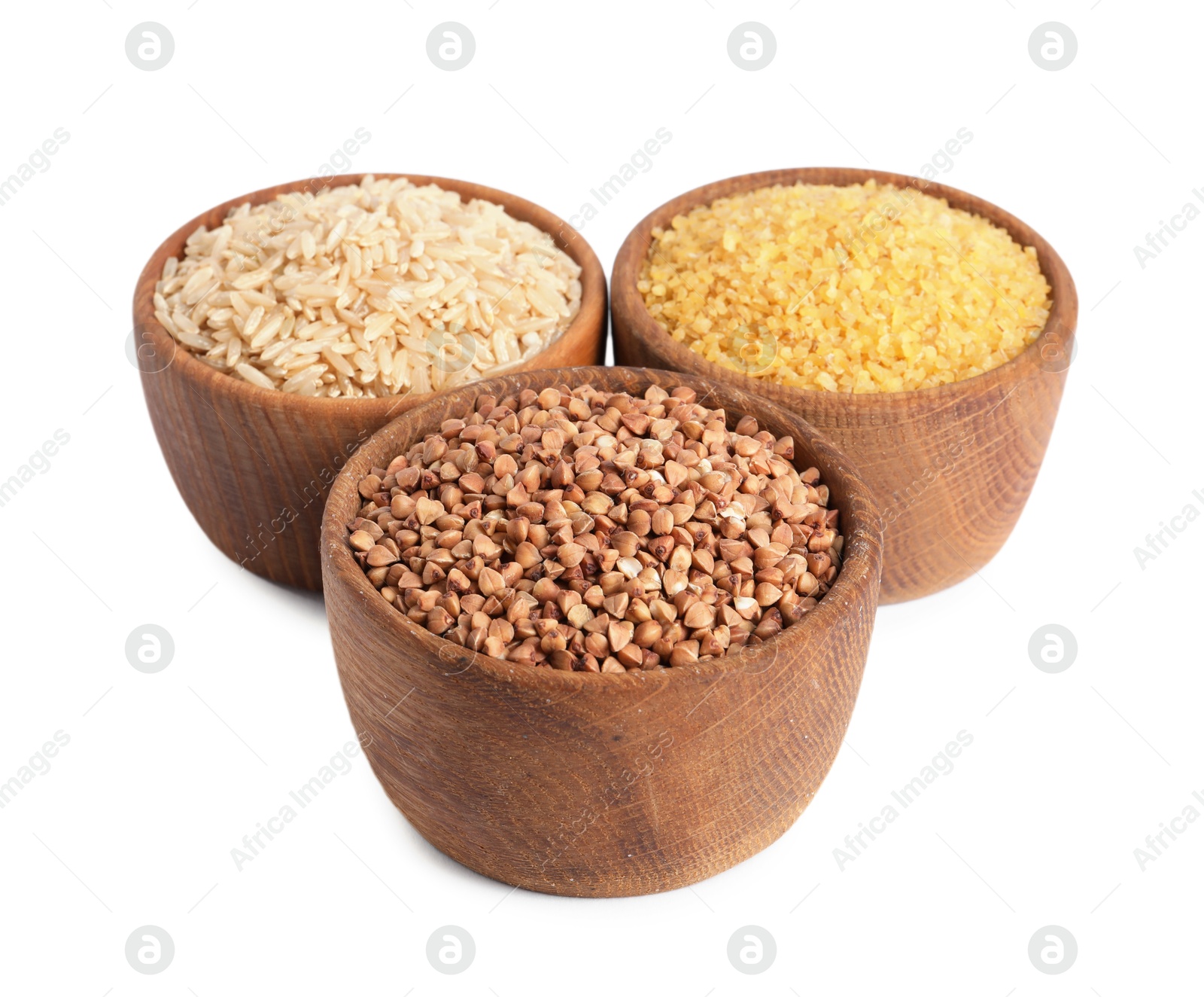 Photo of Different cereal grains in wooden bowls isolated on white