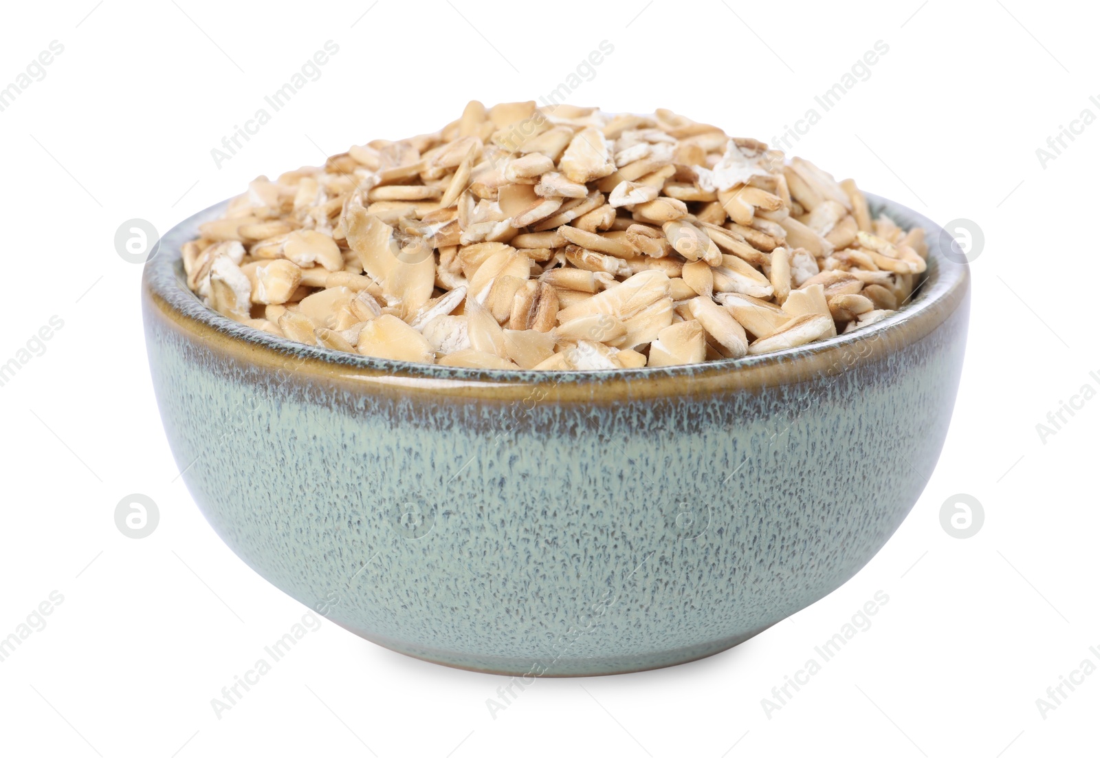 Photo of Dry oat flakes in bowl isolated on white