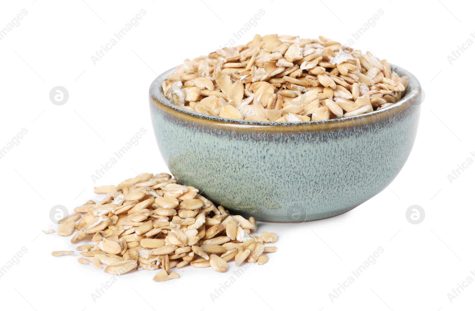 Photo of Dry oat flakes in bowl isolated on white