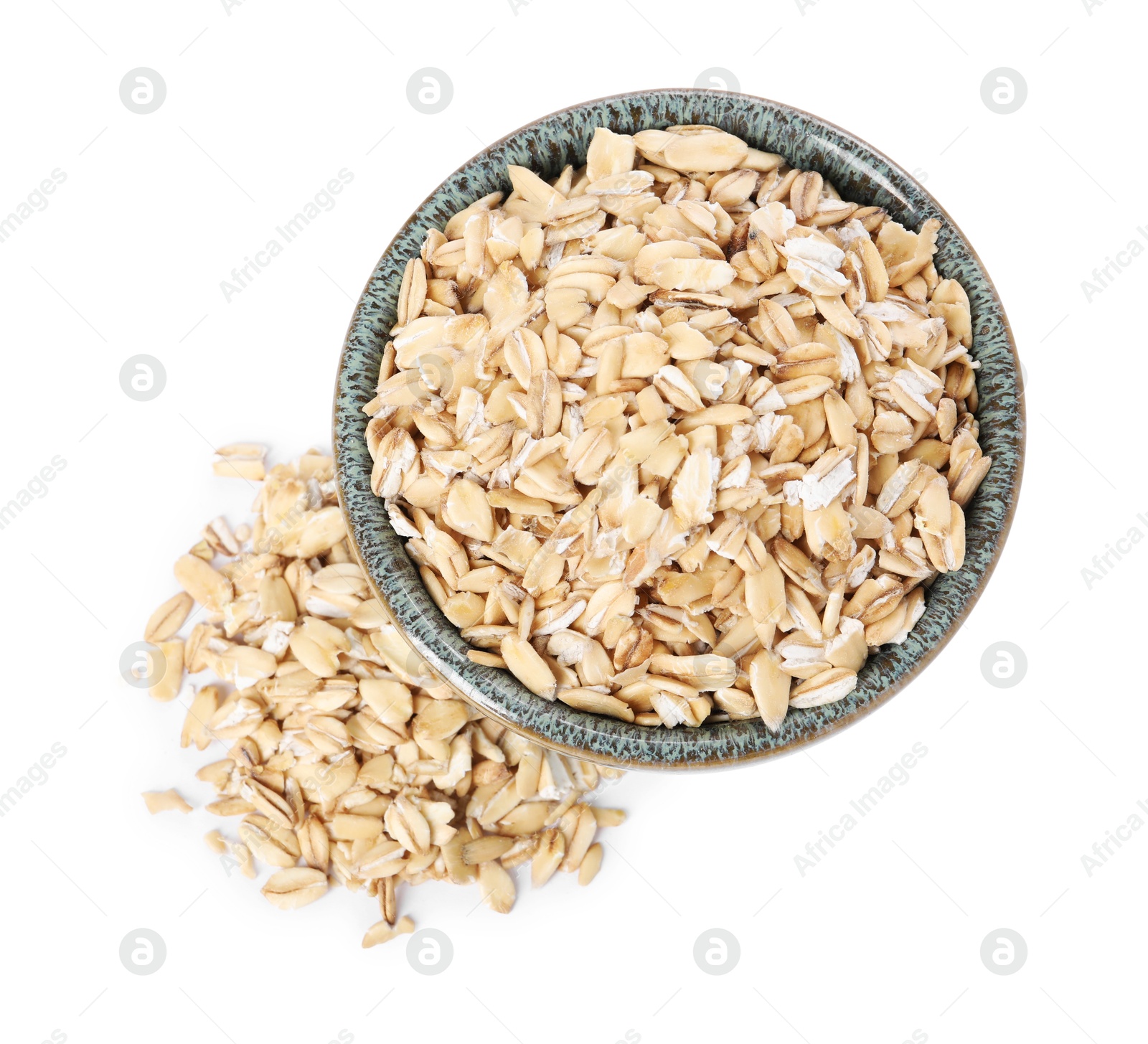 Photo of Dry oat flakes in bowl isolated on white, top view