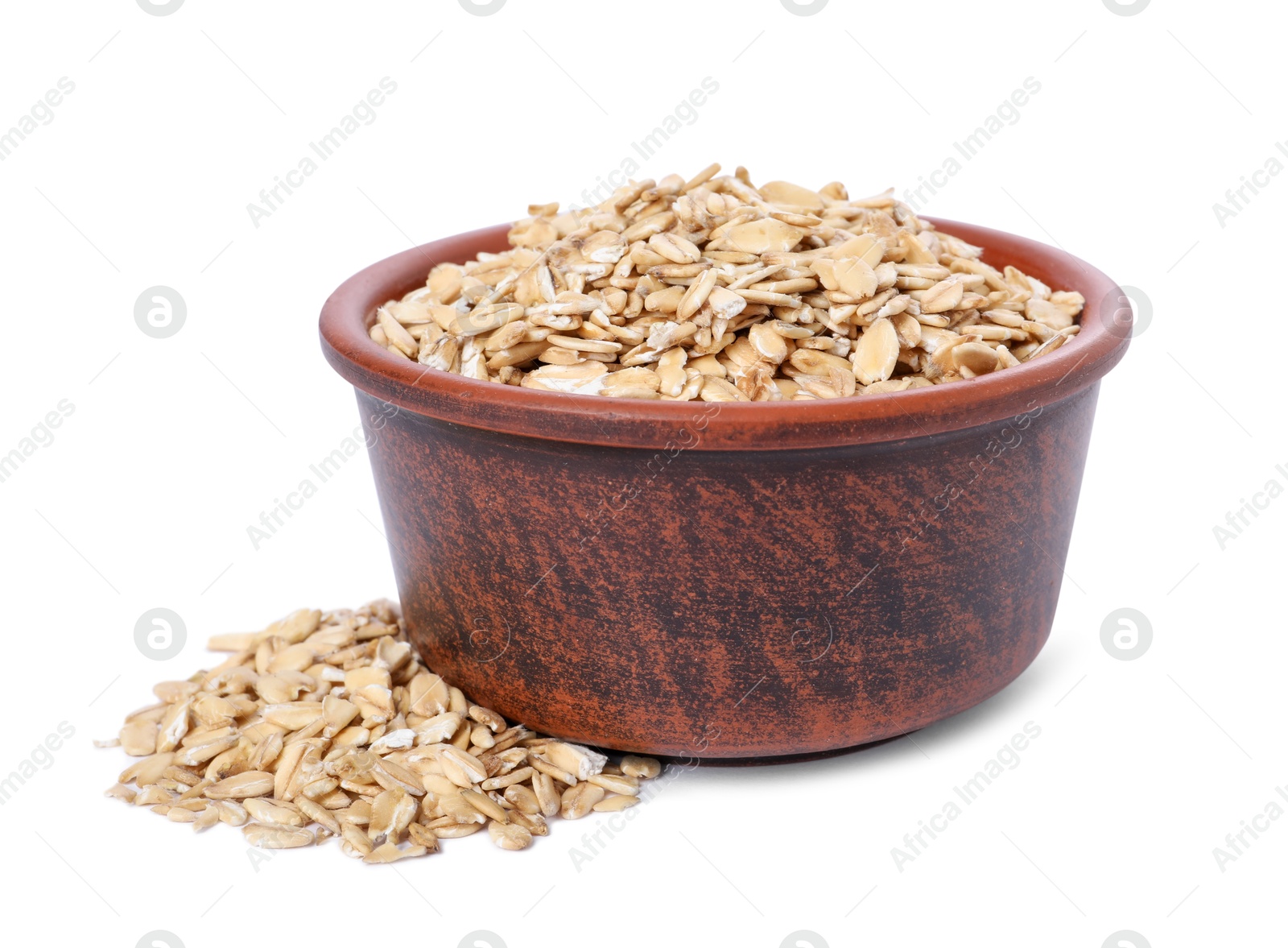 Photo of Dry oat flakes in bowl isolated on white