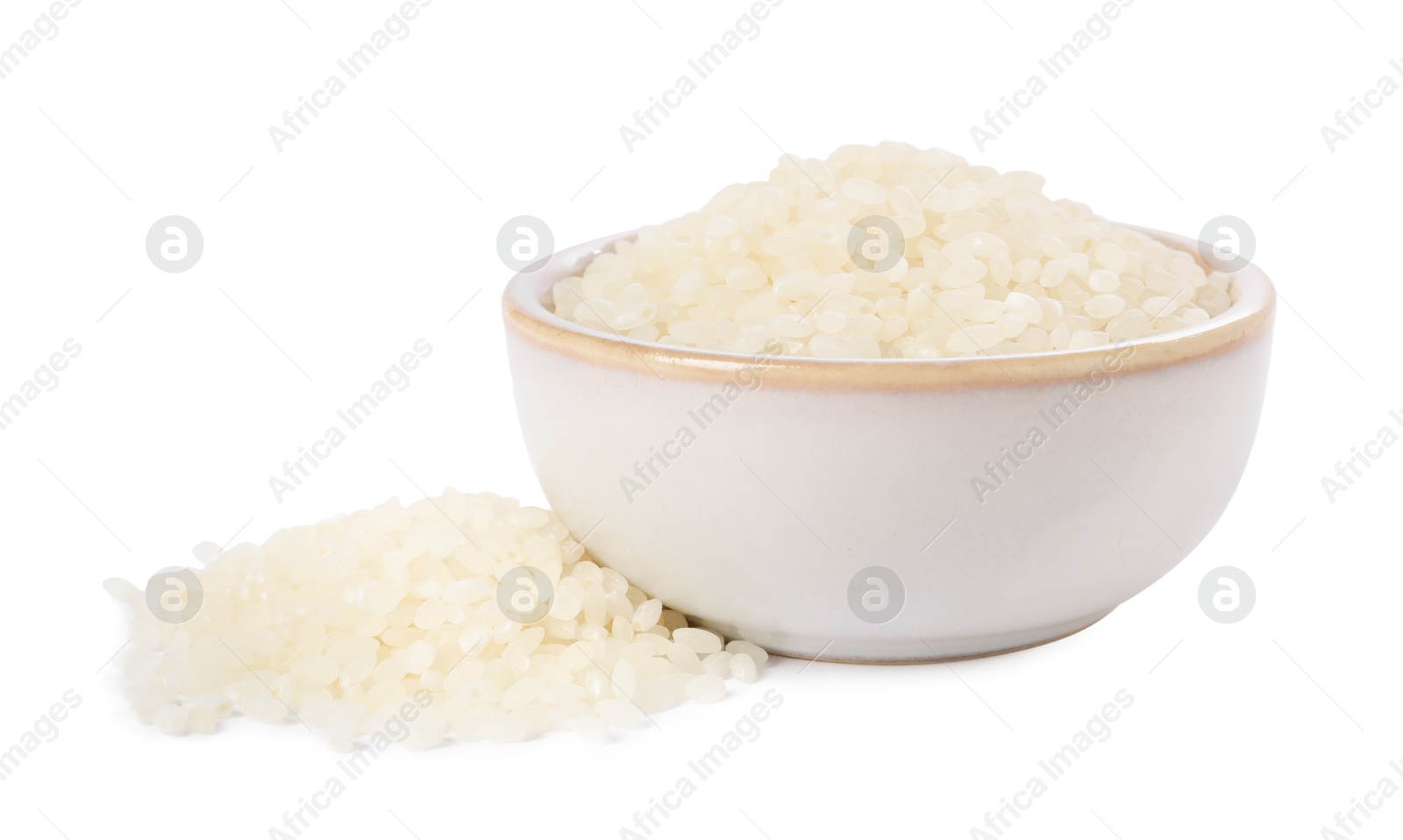 Photo of Raw rice in bowl isolated on white