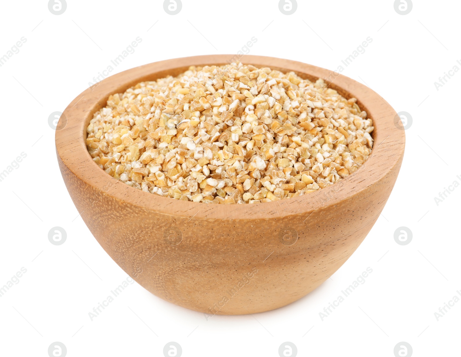 Photo of Dry wheat groats in wooden bowl isolated on white