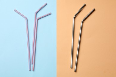 Photo of Plastic and metal drinking straws on color background, flat lay