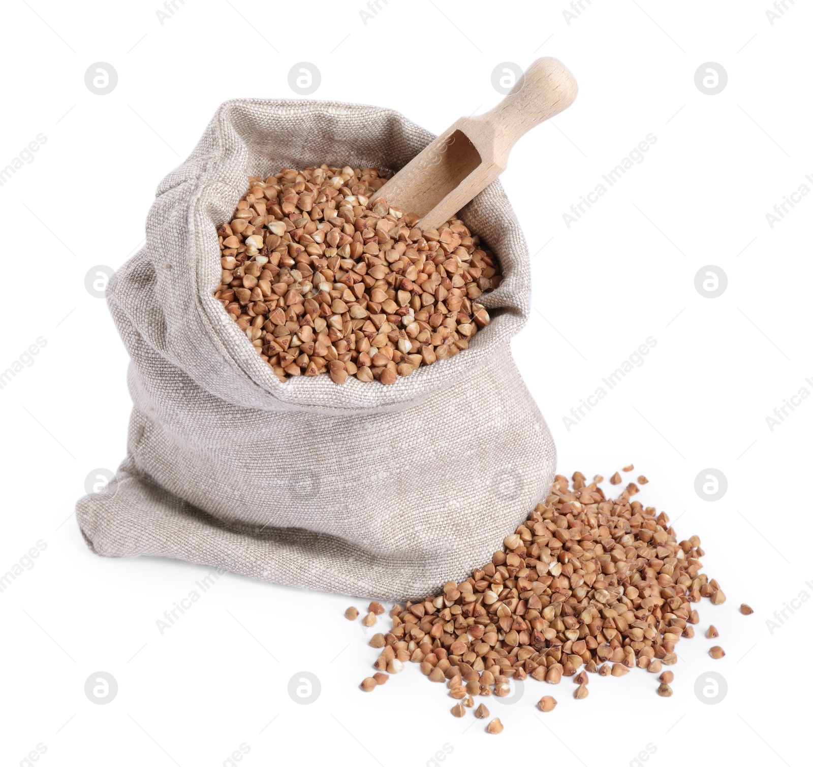 Photo of Raw buckwheat in burlap with scoop isolated on white