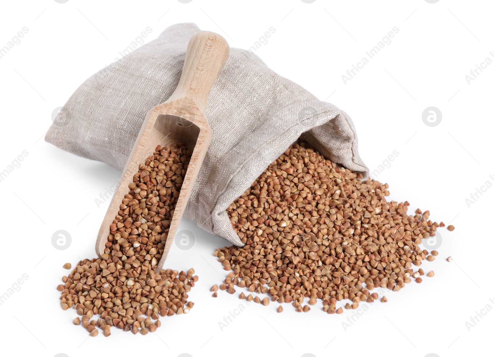 Photo of Raw buckwheat in burlap with scoop isolated on white