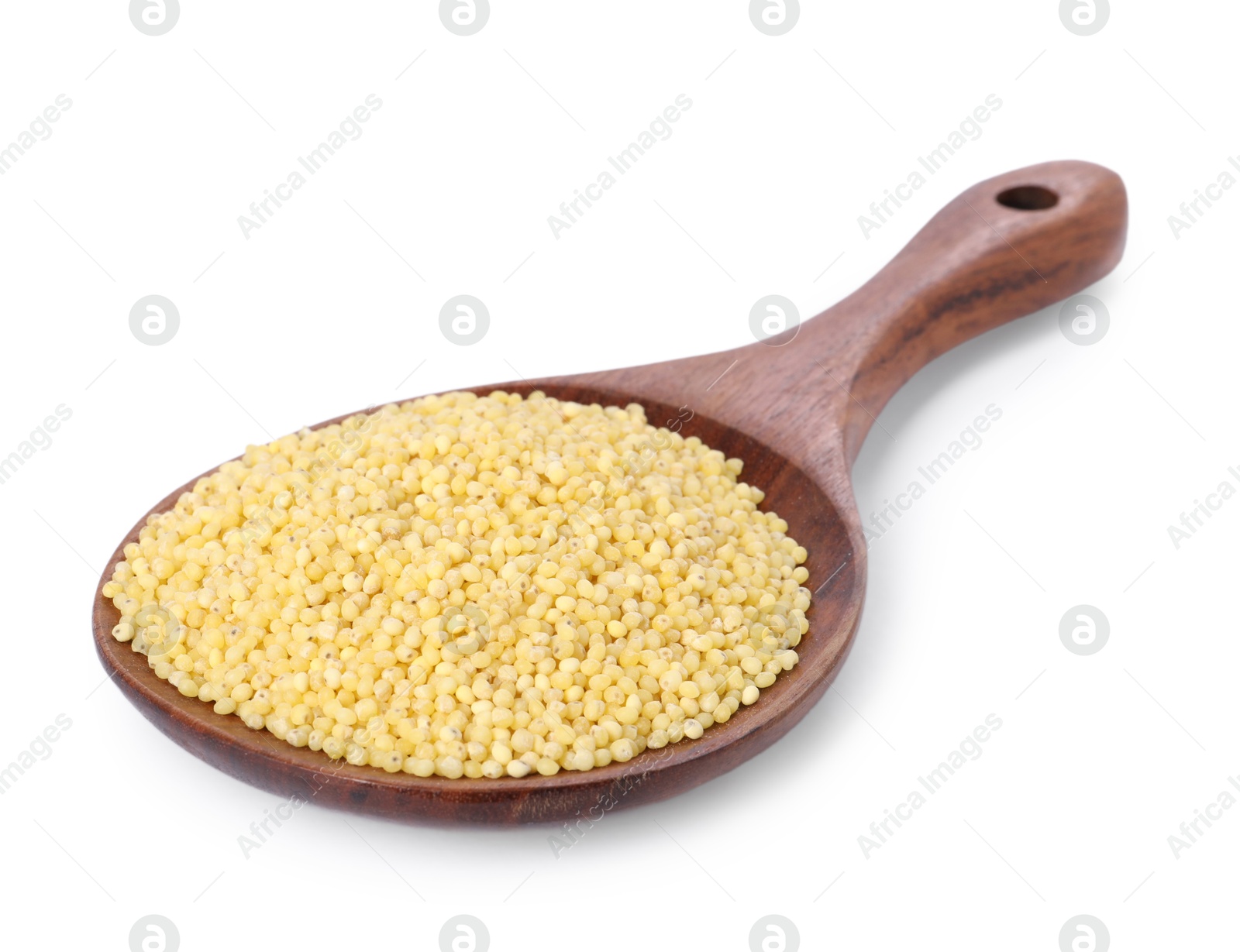 Photo of Millet groats in wooden spoon isolated on white