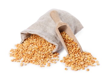 Dried peas, overturned burlap sack and wooden scoop isolated on white