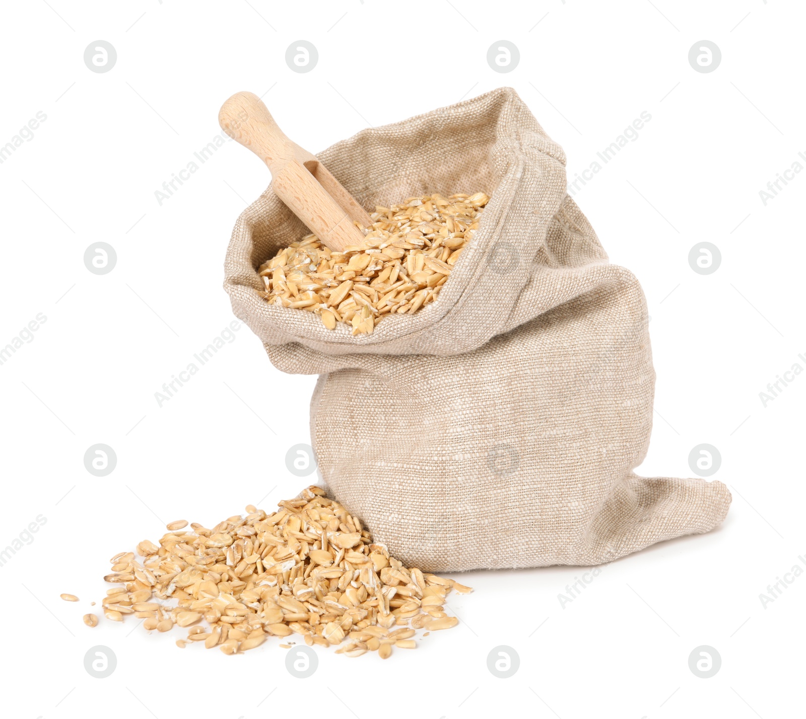 Photo of Dry oat flakes in burlap sack and wooden scoop isolated on white