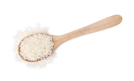 Photo of Raw rice in wooden spoon isolated on white, top view