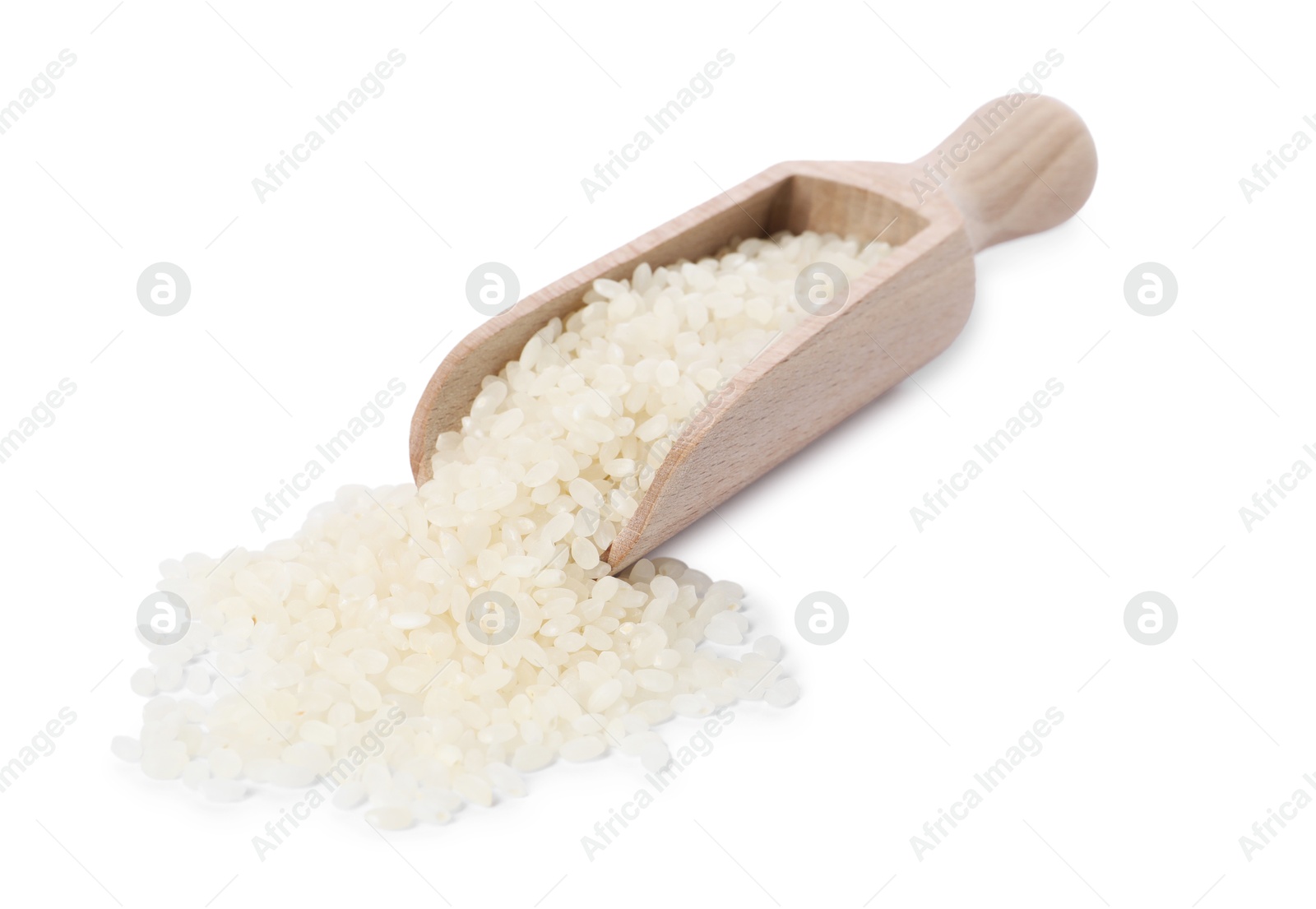 Photo of Raw rice in wooden scoop isolated on white