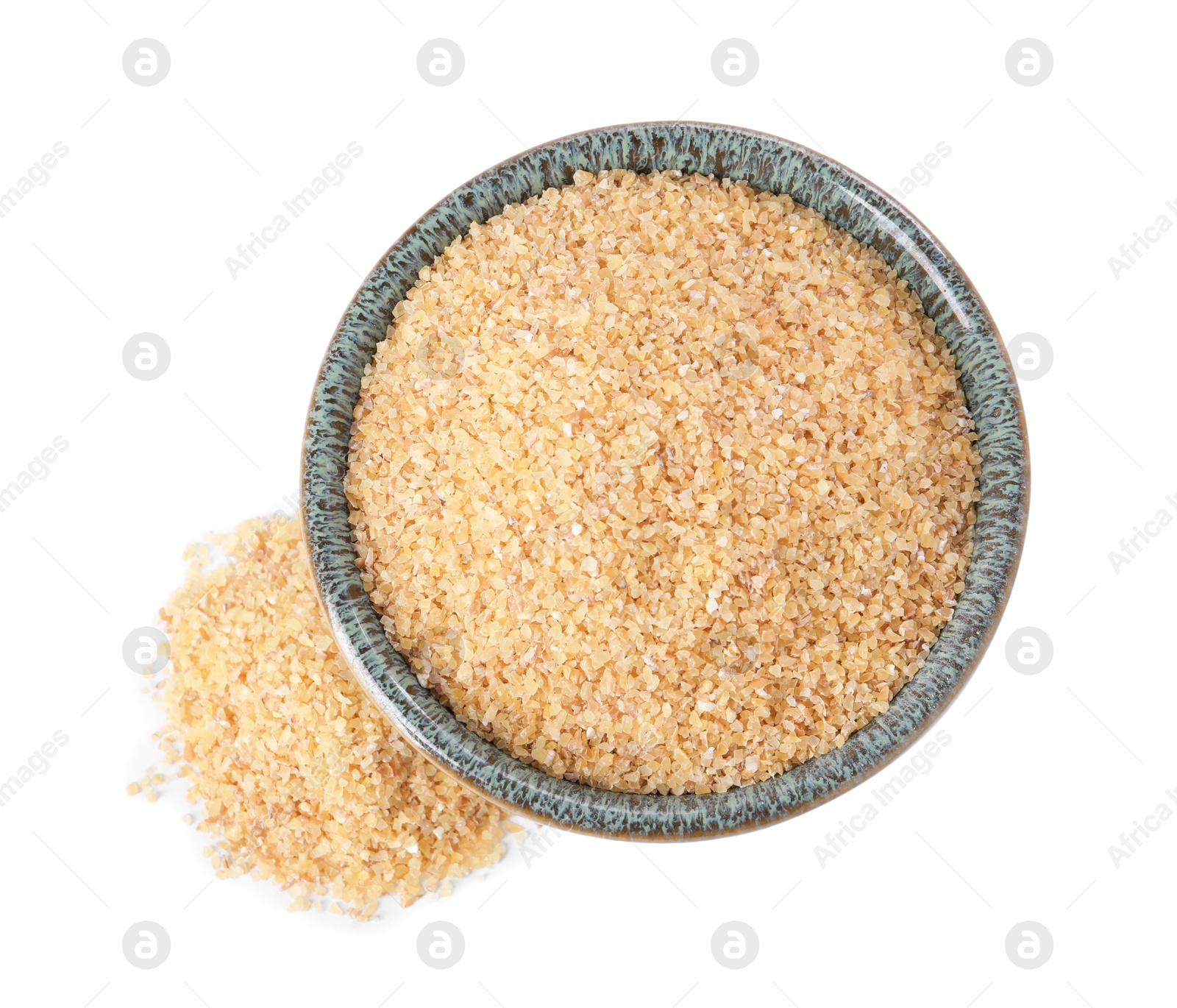 Photo of Raw wheat groats in bowl isolated on white, top view