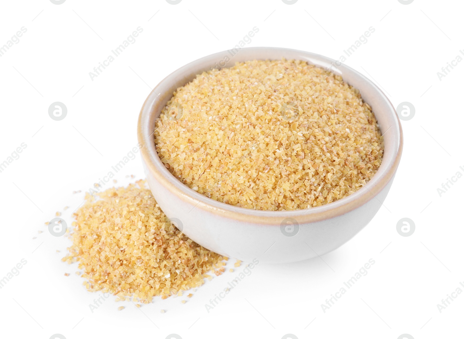 Photo of Raw wheat groats in bowl isolated on white