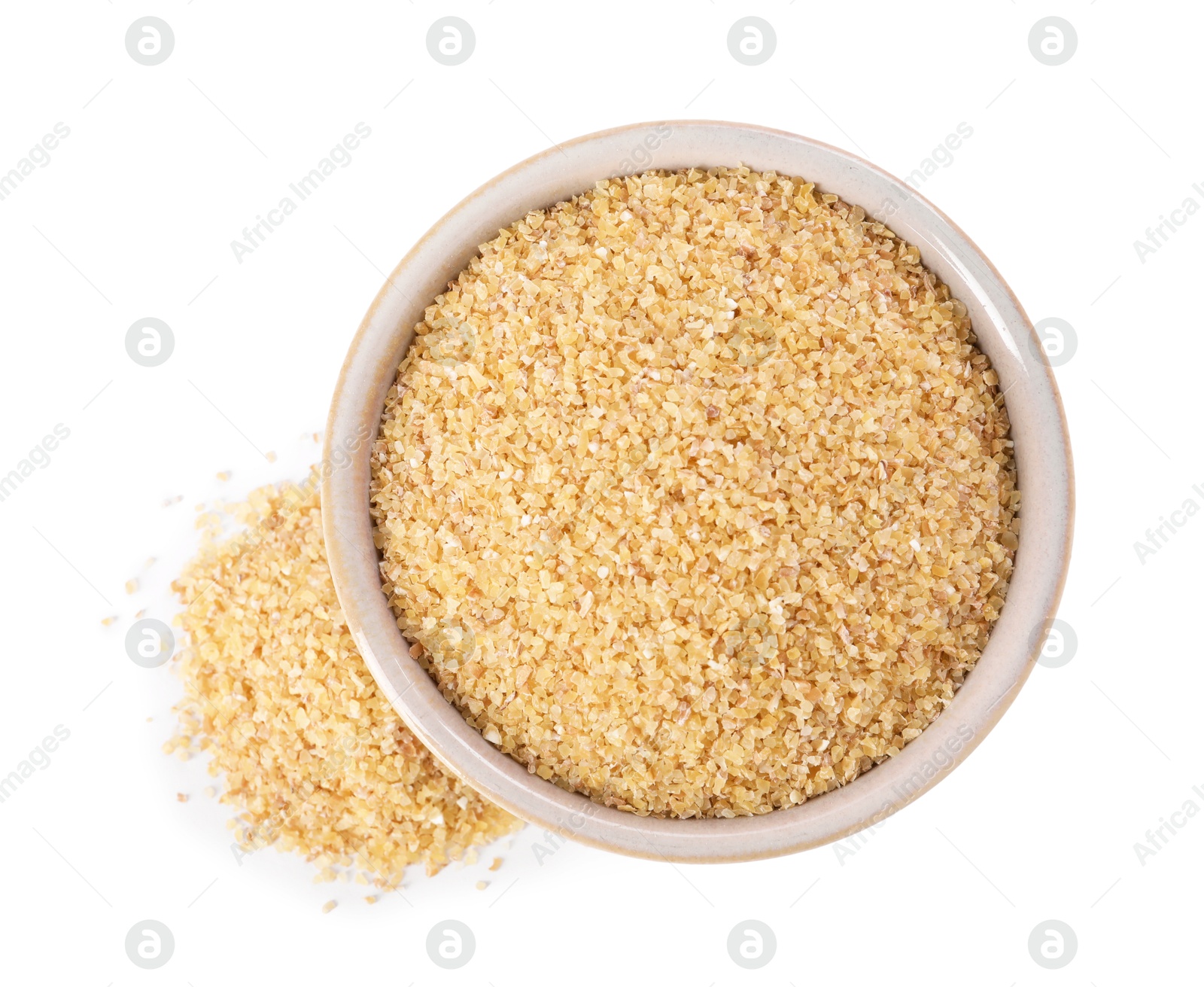 Photo of Raw wheat groats in bowl isolated on white, top view