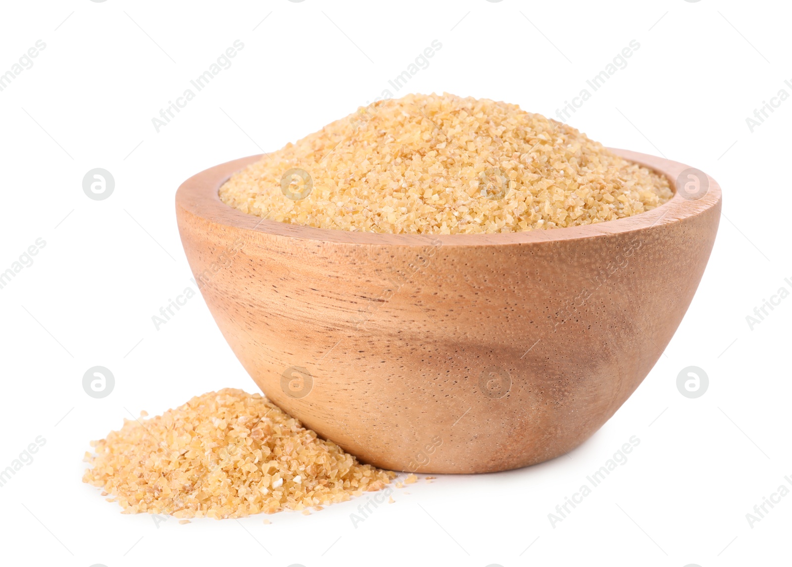 Photo of Raw wheat groats in bowl isolated on white