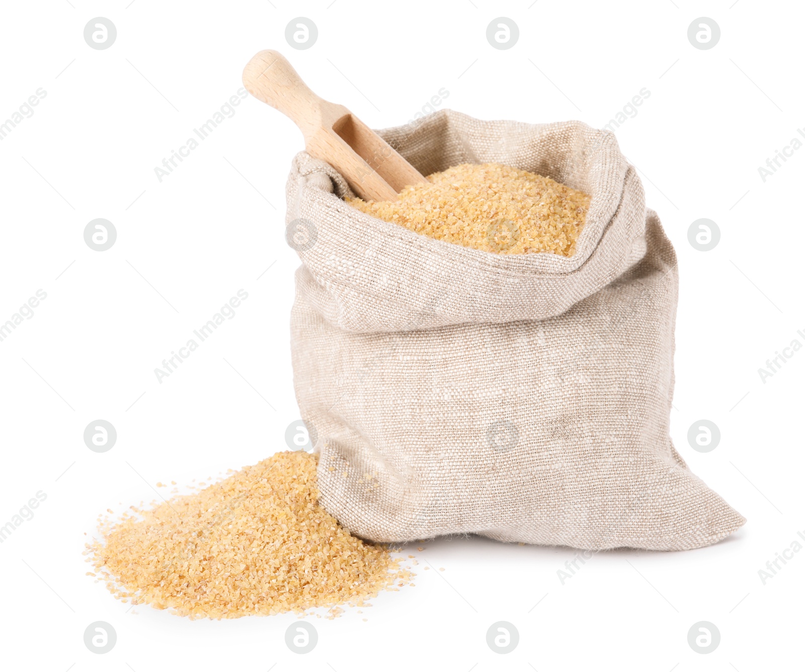 Photo of Raw wheat groats and scoop in sack isolated on white