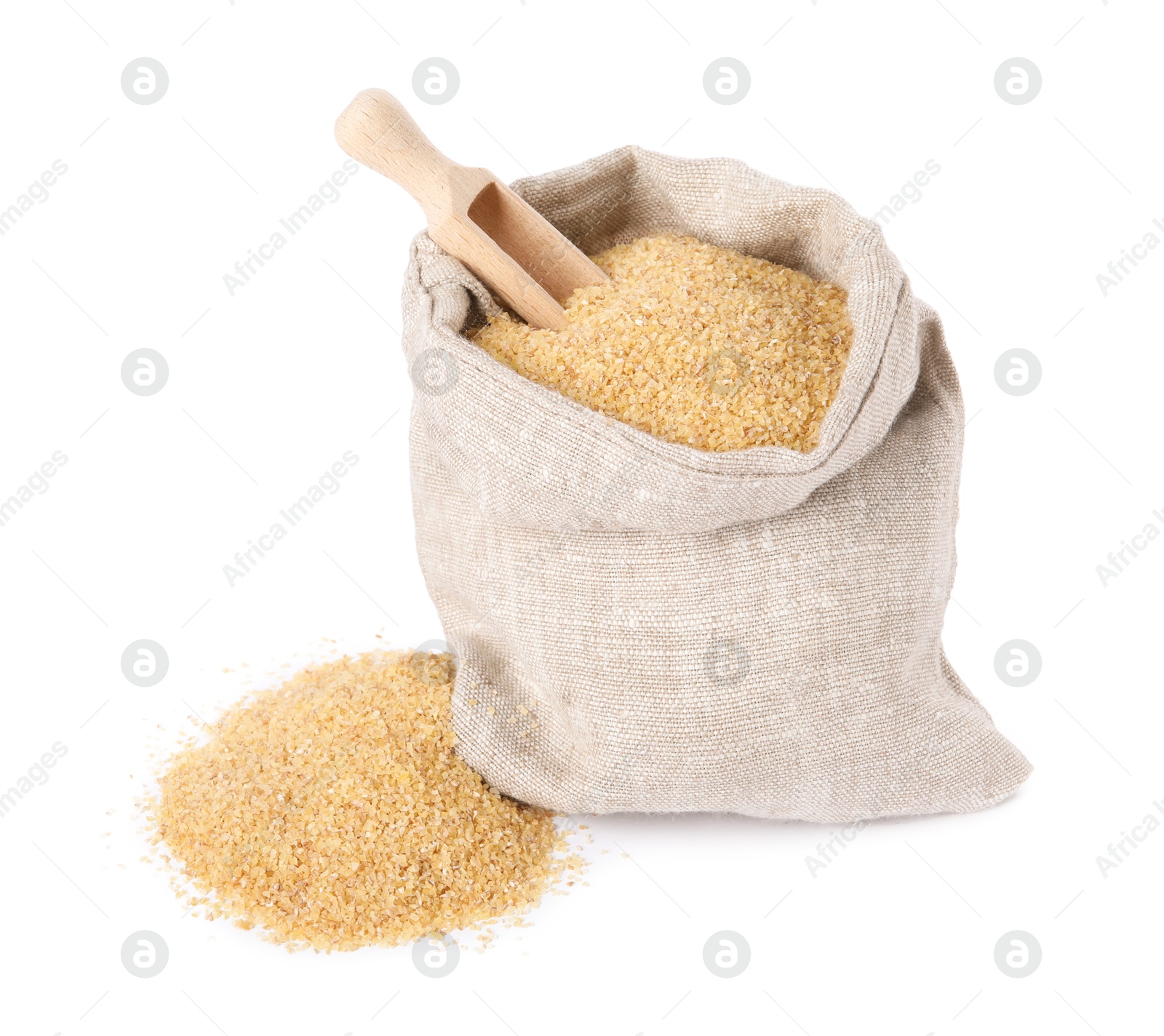 Photo of Raw wheat groats and scoop in sack isolated on white