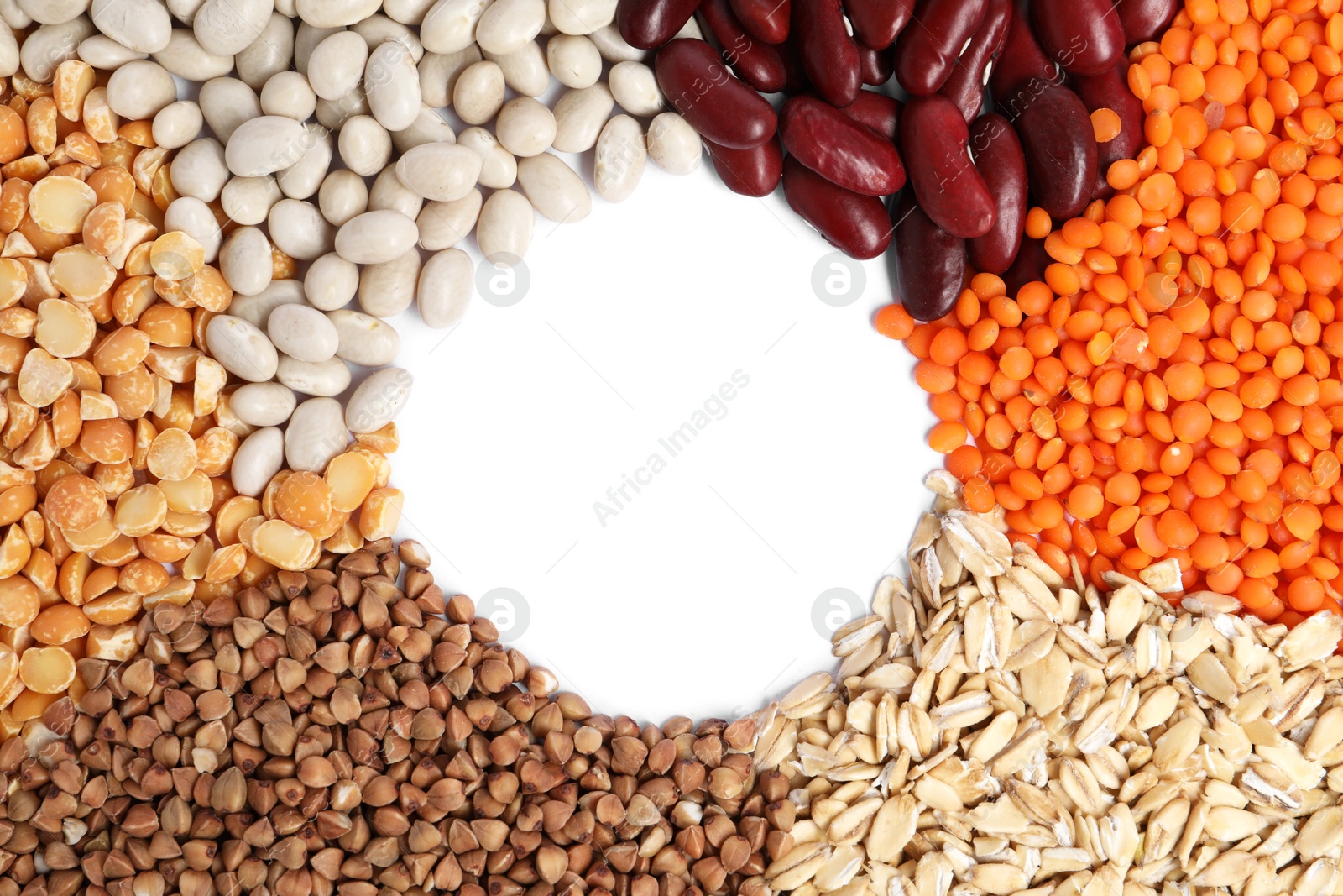 Photo of Frame of cereals and legumes on white background, top view. Space for text