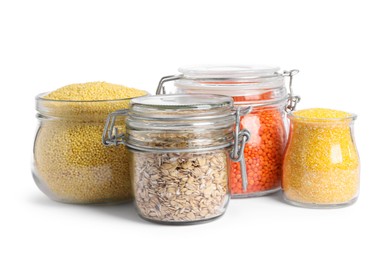 Photo of Different cereals and lentils in jars isolated on white