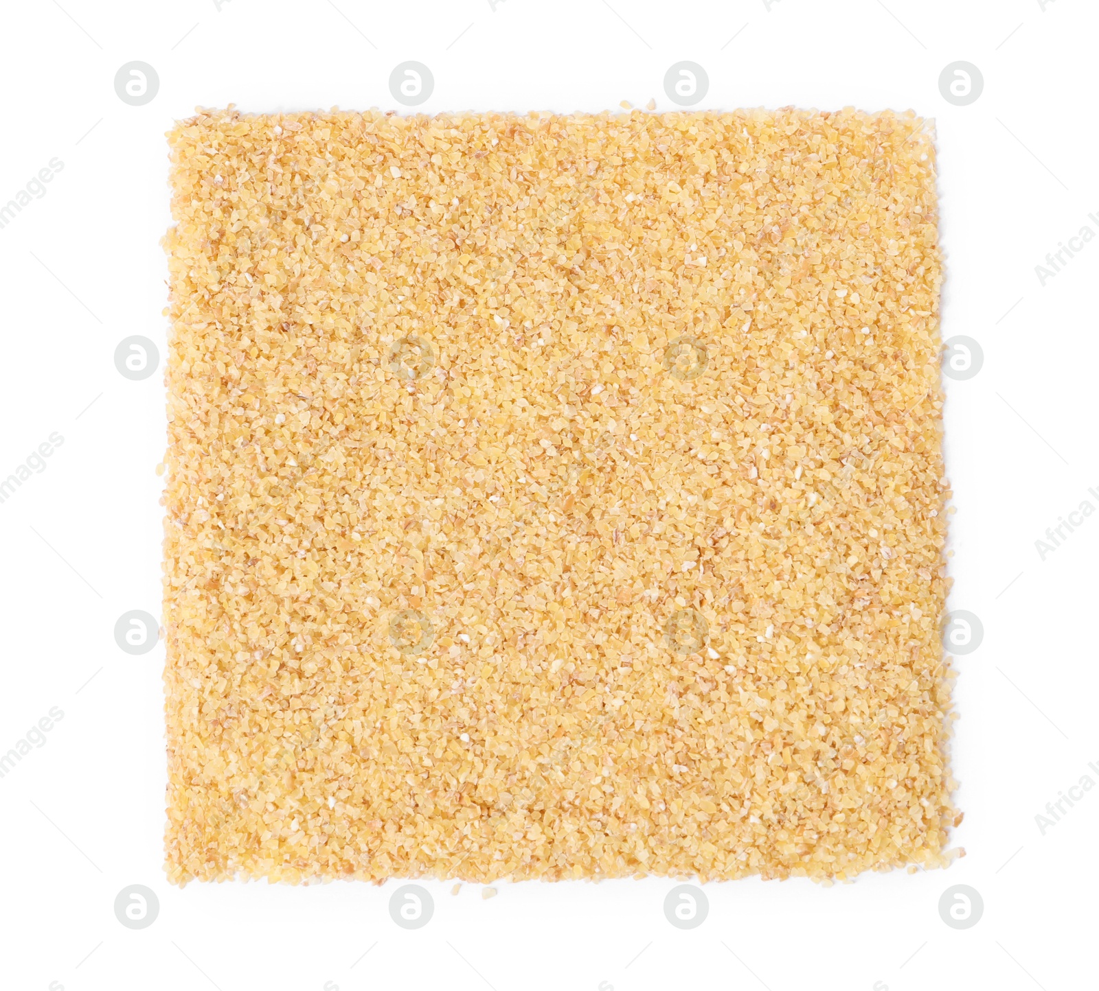 Photo of Pile of raw wheat groats isolated on white, top view