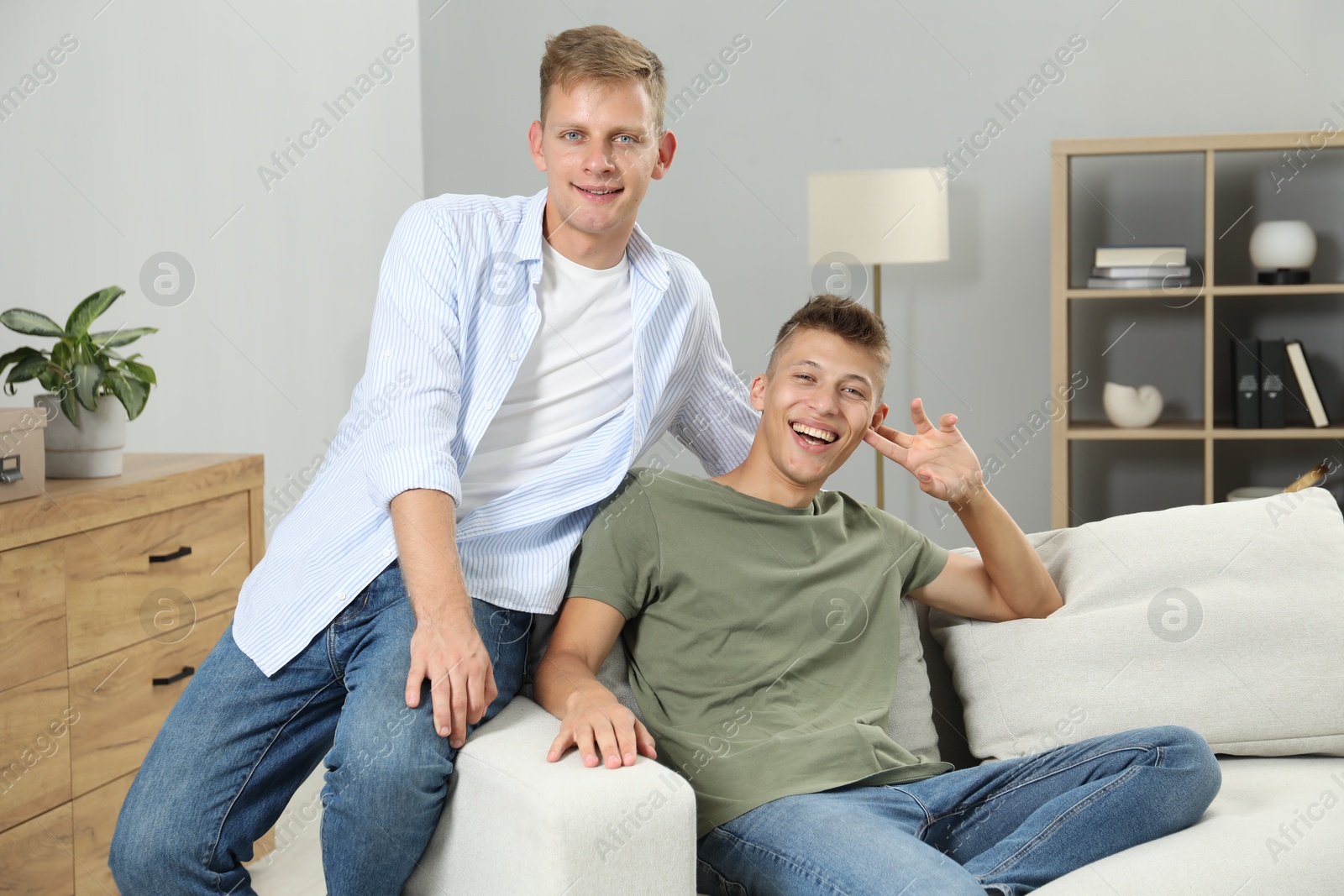 Photo of Happy brothers spending time together at home