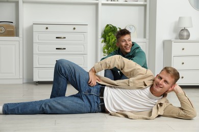 Happy brothers spending time together at home