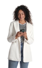 Beautiful woman in stylish jacket using smartphone on white background