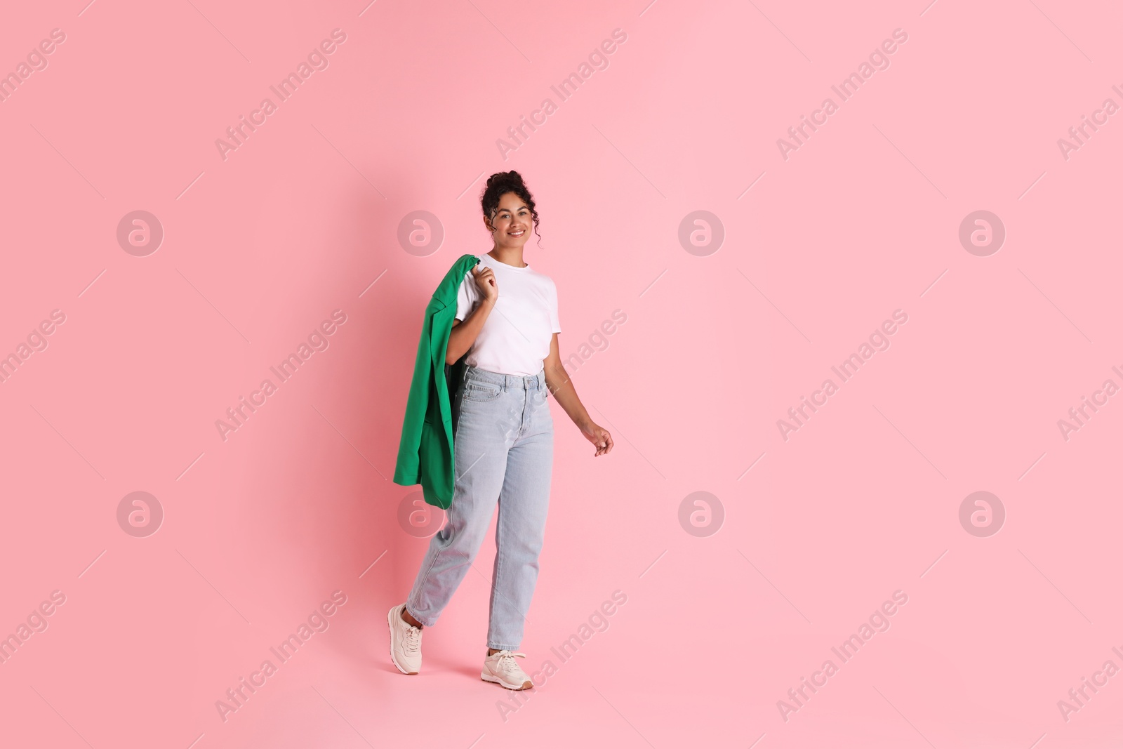 Photo of Beautiful woman with stylish jacket on pink background