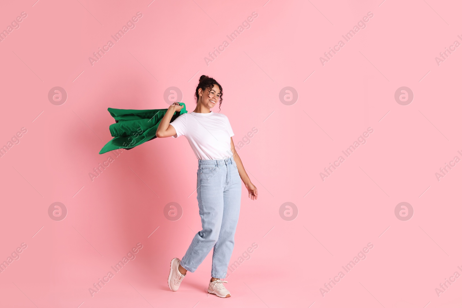 Photo of Beautiful woman with stylish jacket on pink background