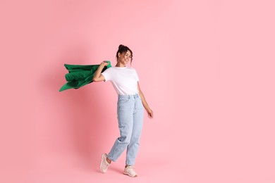 Photo of Beautiful woman with stylish jacket on pink background