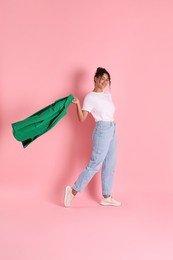 Photo of Beautiful woman with stylish jacket on pink background