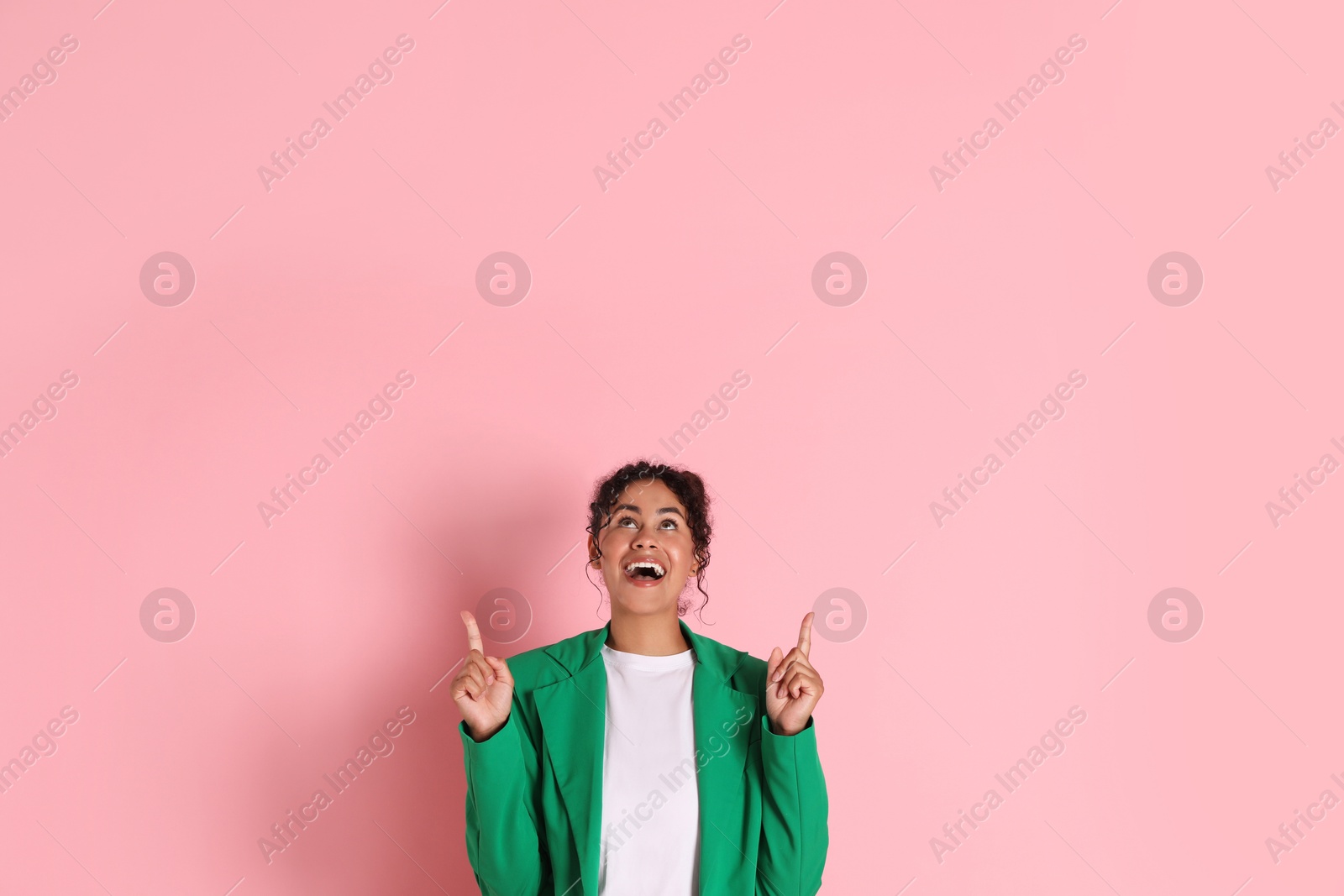 Photo of Beautiful woman in stylish jacket on pink background, space for text