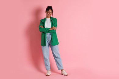 Photo of Beautiful woman in stylish jacket on pink background