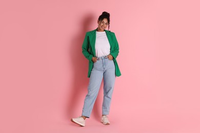 Photo of Beautiful woman in stylish jacket on pink background