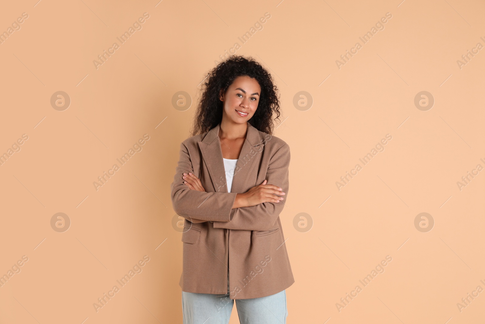 Photo of Beautiful woman in stylish jacket on beige background