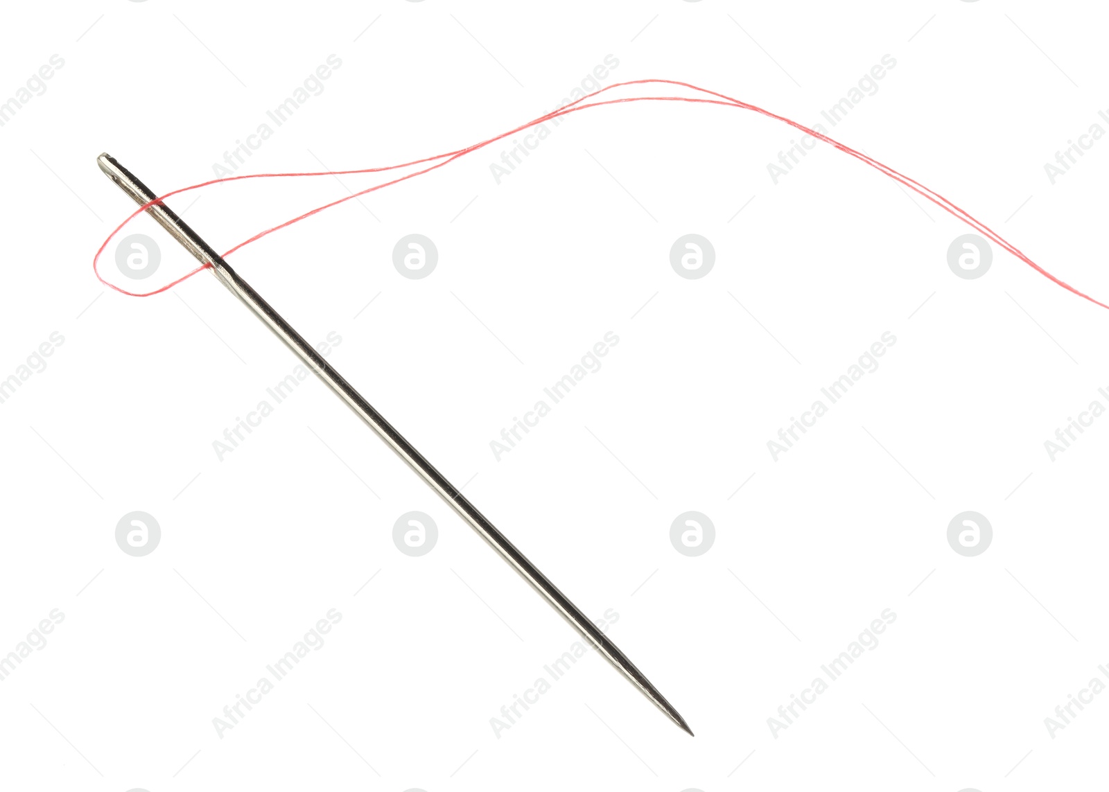 Photo of Sewing needle with red thread isolated on white