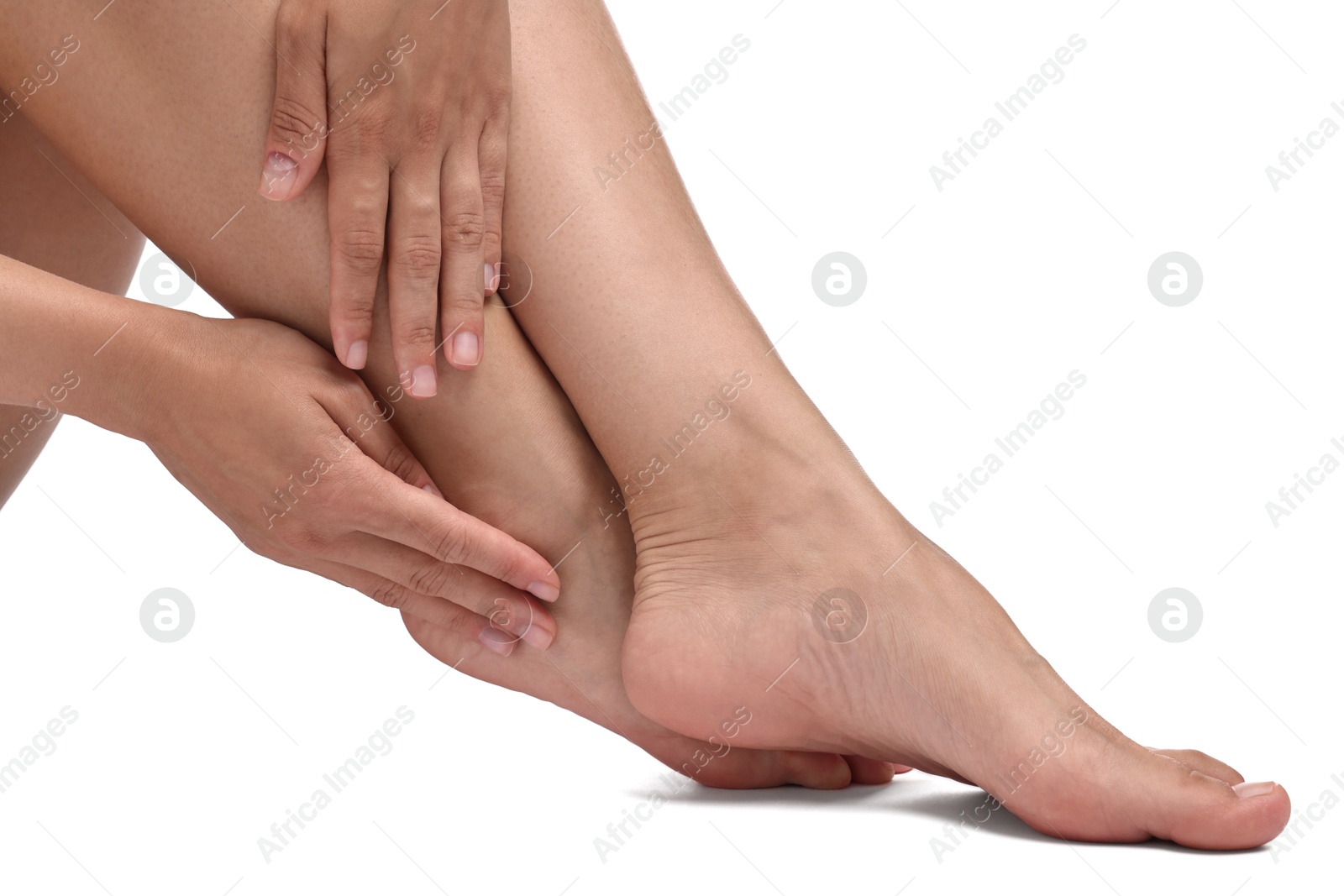 Photo of Woman touching her smooth feet on white background, closeup