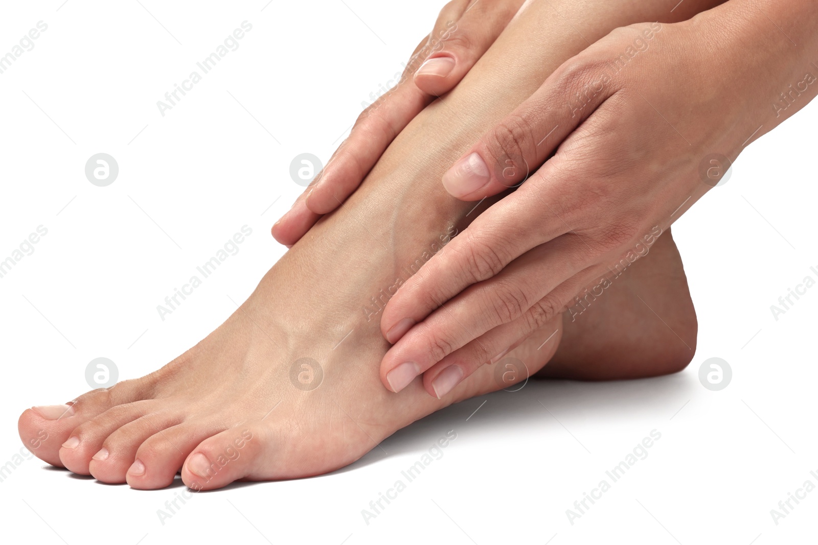 Photo of Woman touching her smooth feet on white background, closeup