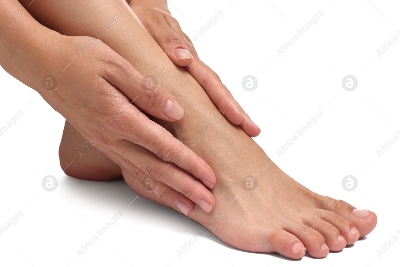 Photo of Woman touching her smooth feet on white background, closeup