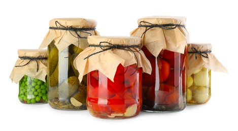 Photo of Different pickled products in jars isolated on white