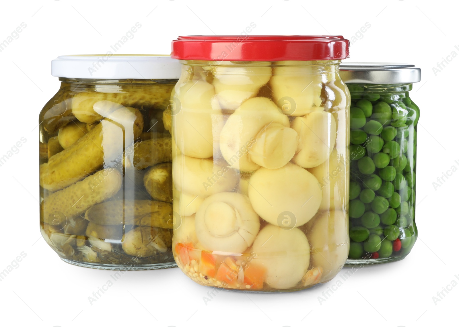 Photo of Different pickled products in jars isolated on white