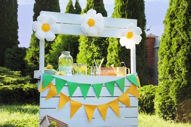 Photo of Lemonade stand with refreshing drink in park