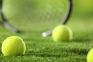 Photo of Tennis balls on green grass, closeup view