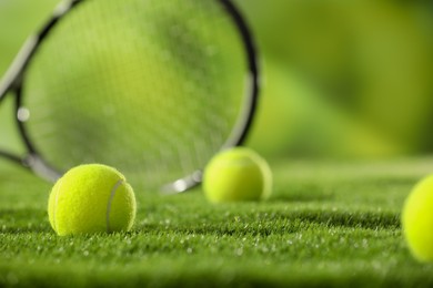 Photo of Tennis balls on green grass, closeup view