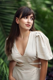 Photo of Portrait of beautiful woman in tropical forest