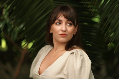 Photo of Portrait of beautiful woman in tropical forest