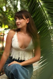 Portrait of beautiful woman in tropical forest