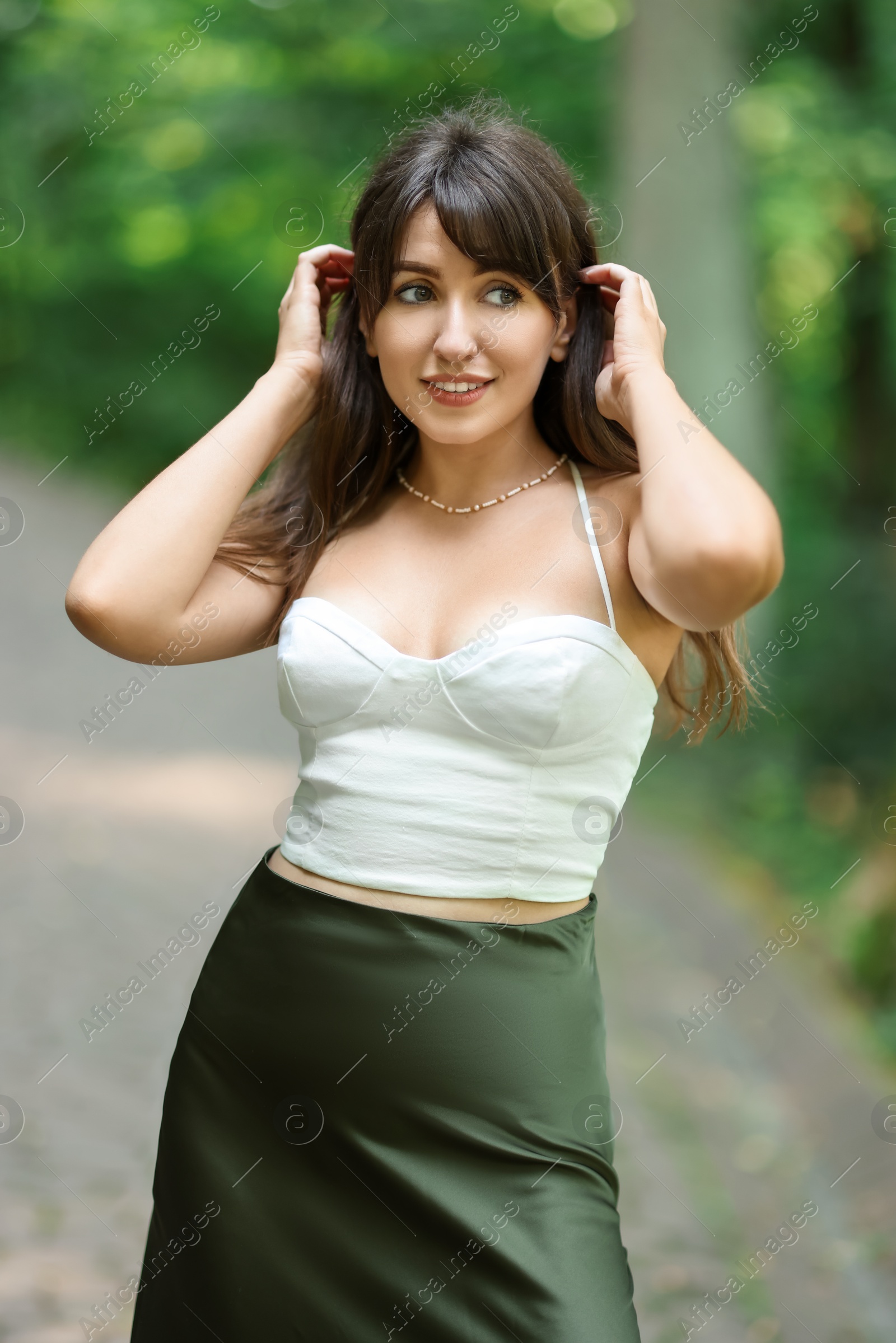 Photo of Portrait of beautiful woman posing in park