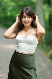 Portrait of beautiful woman posing in park